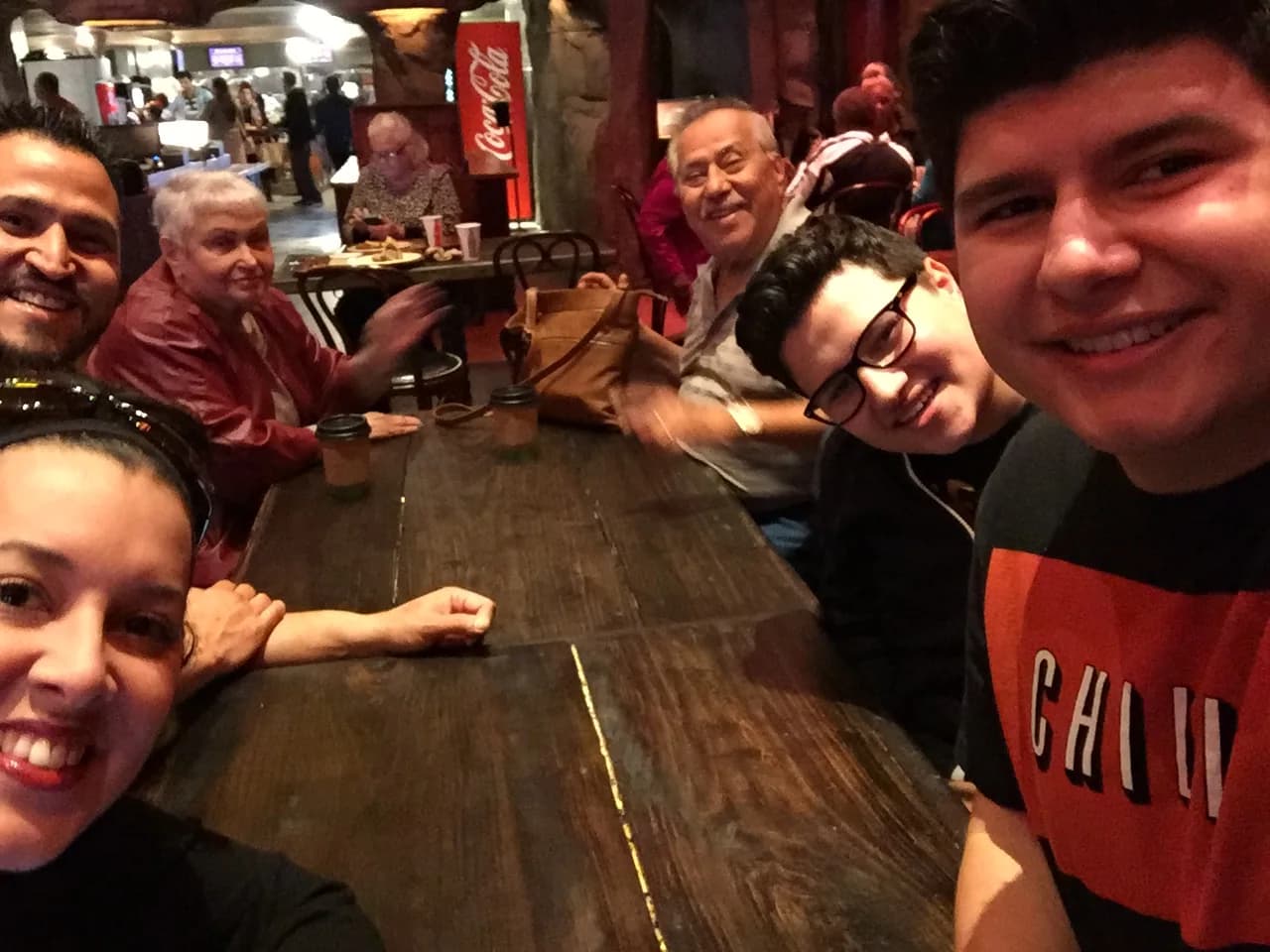 Members of the Grijalva family gathered around a restaurant table in 2016